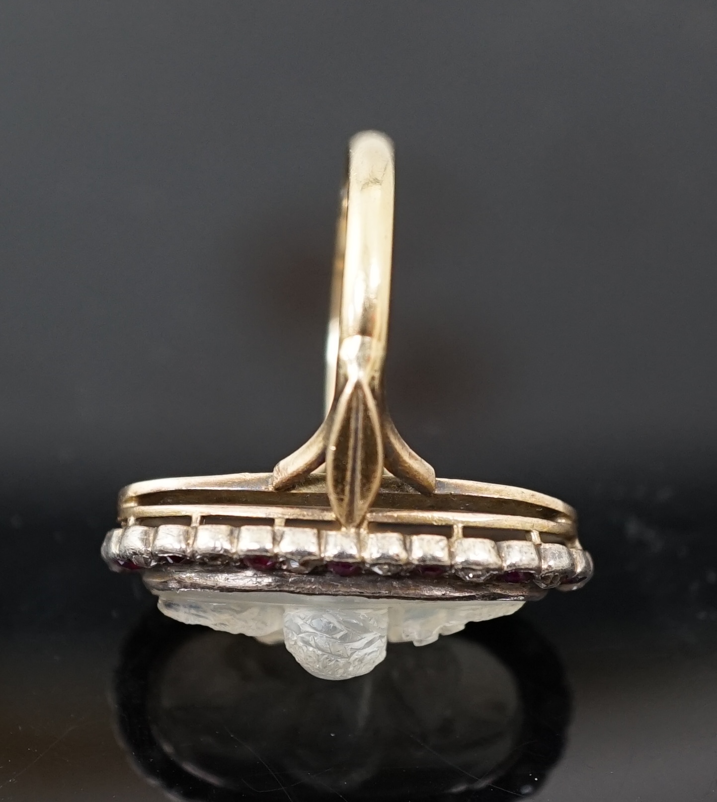 A 1930's continental 14k gold, moonstone?, ruby and diamond cluster set upfinger ring